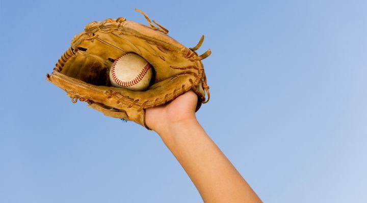 Gloved hand that has just caught the baseball