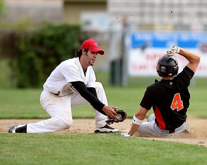 baseball player sliding into base